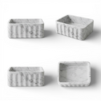 Four marble-textured rectangular containers on a white background